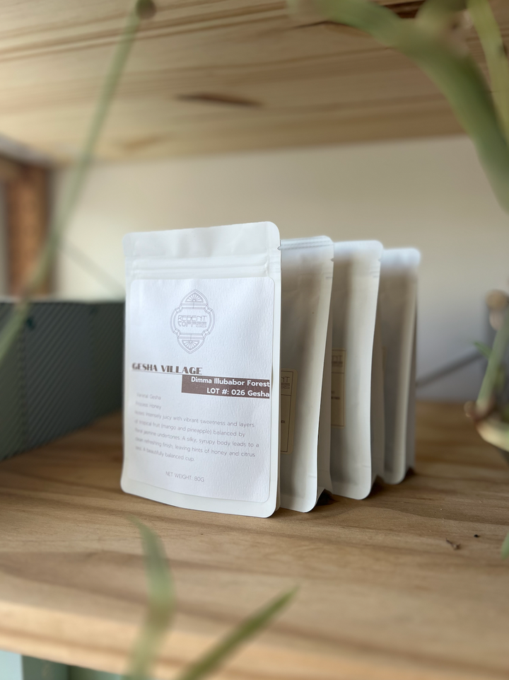 4 80g coffee bags on a light wood shelf