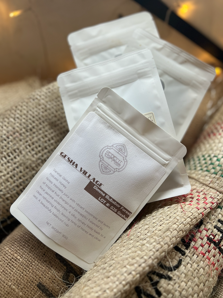 Tasting Quartet of 4 80g bags on coffee resting on burlap bags