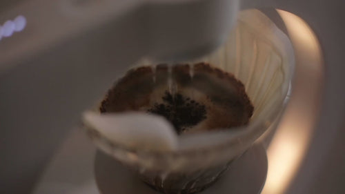 Hiroia Hikaru smart brewer demonstrating automated pour-over coffee brewing.