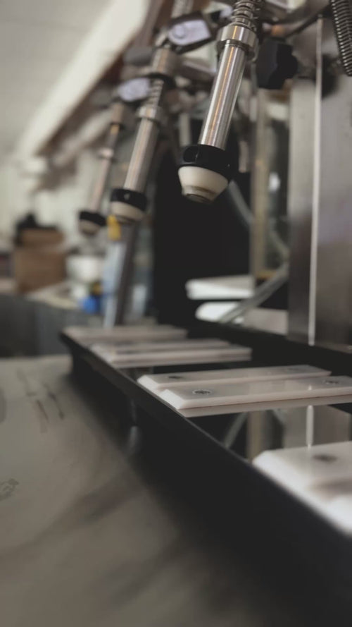 Video of filling glass bottles with a filling machine