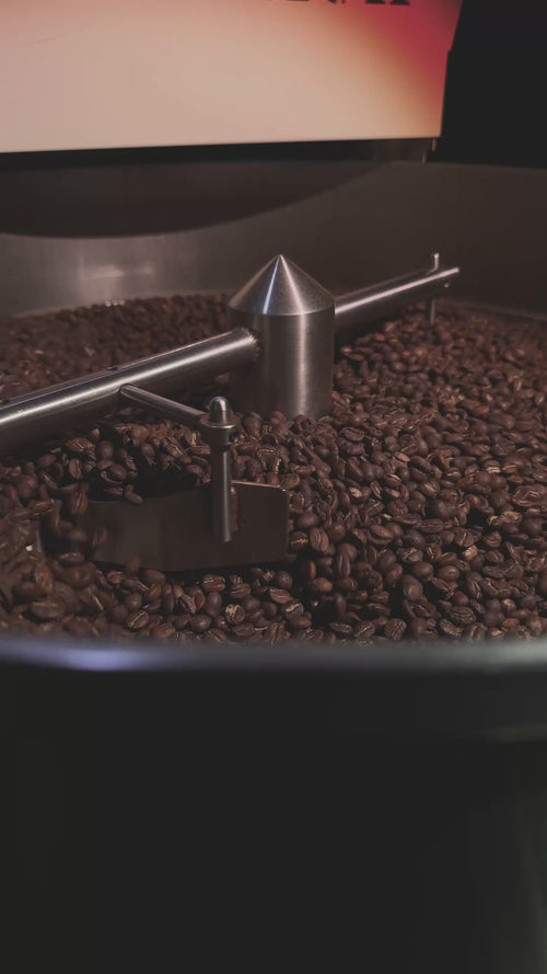 Video of a roaster cooling bin with roasted coffee beans in it